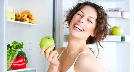 Healthy woman eating an apple